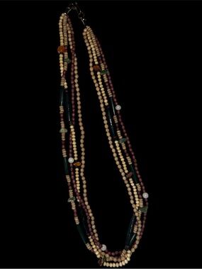 Vintage ethic vibe ceramic? And glass? Beads. Not plastic